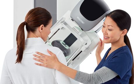 Woman receiving a mammogram examination.