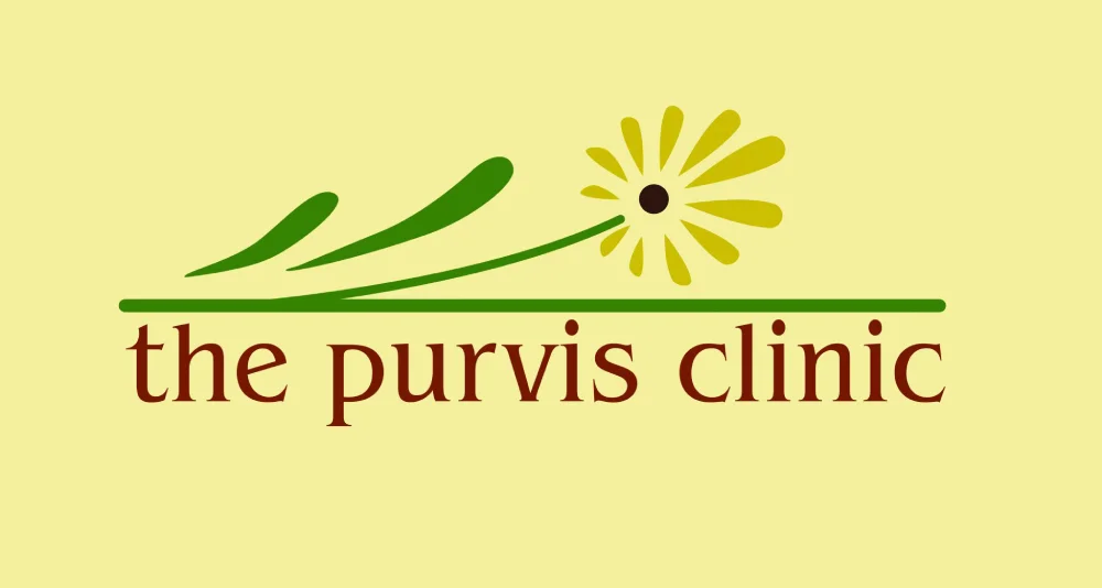 Logo of The Purvis Clinic with a flower.
