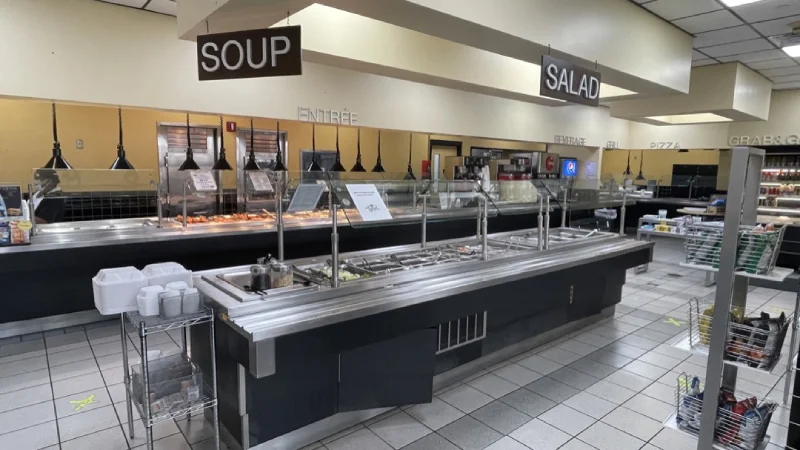 Cafeteria serving stations labeled Soup, Salad, and Entrée.