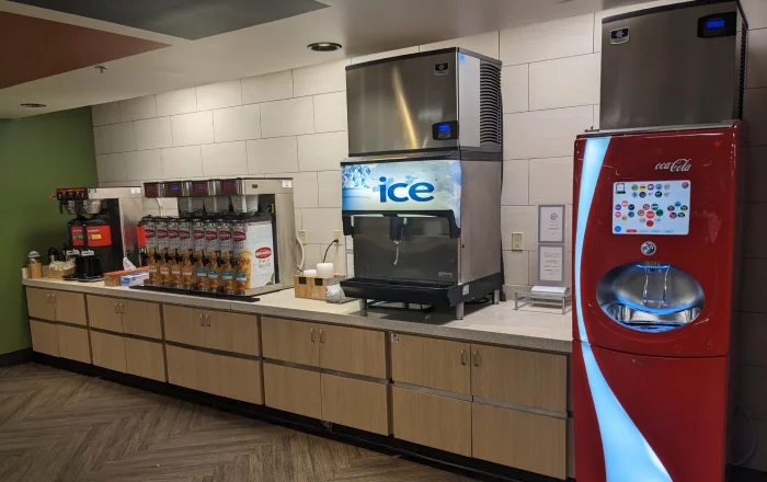 Self-serve hotel beverage station with ice machine.